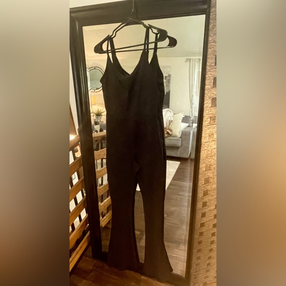 Spandex yoga body suit with wide leg at the bottom size Medium black
